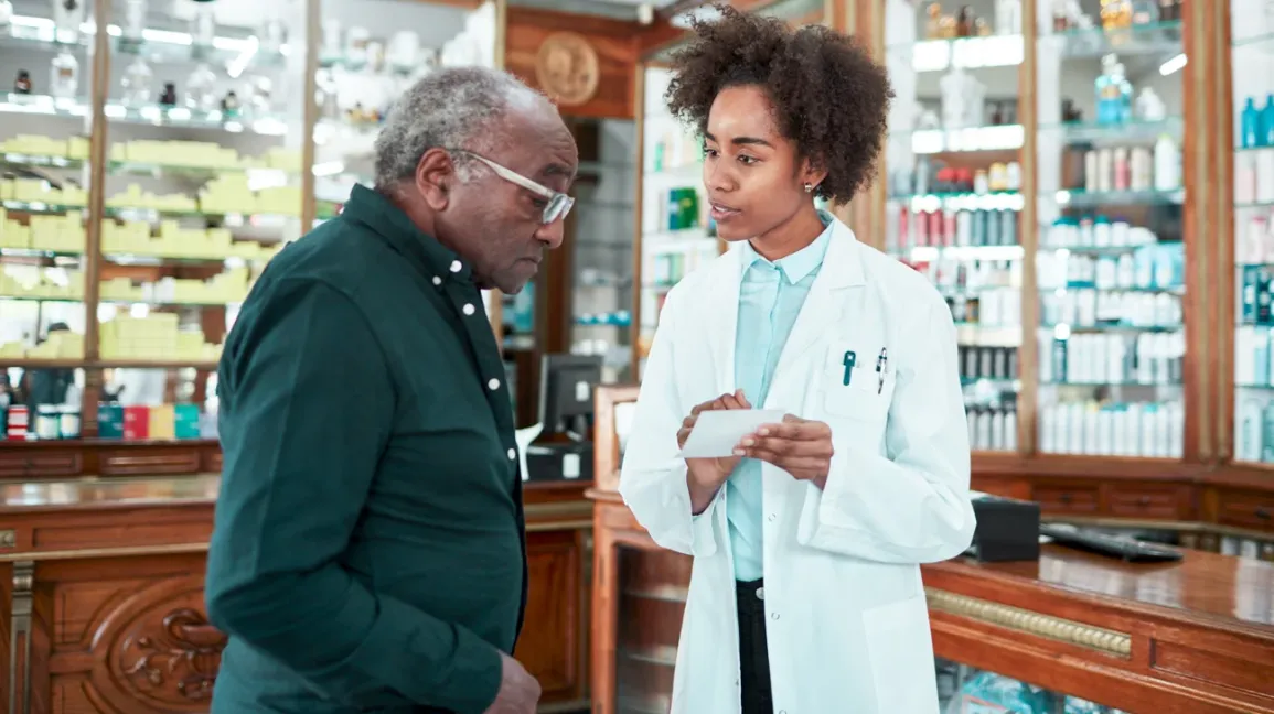 pharmacist-advising-senior-customer-at-drugstore-1296x728-header